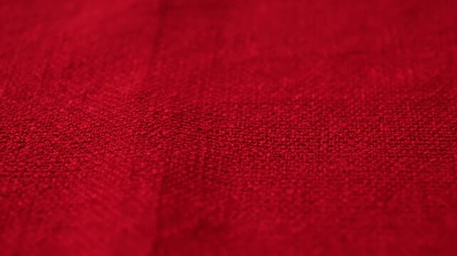 Red leather fabric texture background with a rich textured surface pattern