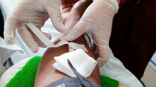 POV of a man donating blood at a hospital transfusion unit. Medical procedure using sterile needle and tube in arm. Voluntary blood donation concept, healthcare and lifesaving support.