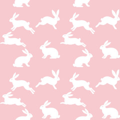 Seamless repeating pattern of white bunny rabbit silhouettes on blush pink. Minimal cute Easter and spring design for textiles, nursery, wallpaper and gift wrap.