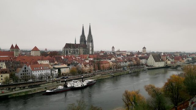 Vertical Drone Rise from River to Overhead View of Regensburg Cathedral