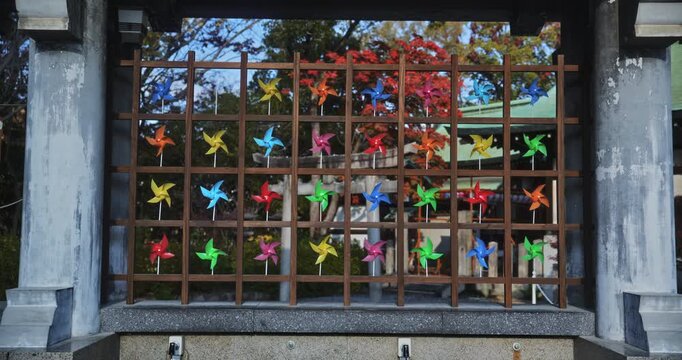 Many colorful pinwheels in old Japanese village