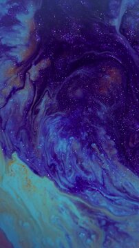 Vertical video. Paint oil fluid. Blur gasoline leak. Defocused purple orange color mix texture water glitter liquid flow on abstract art background.