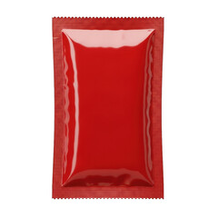 A red foil packet of ketchup on a white background isolated on transparent background