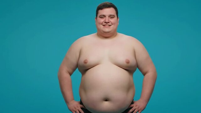 Powerful studio portrait shirtless overweight man standing confidently against turquoise background Campaigns projects focused body positivity self acceptance diversity breaking societal standards