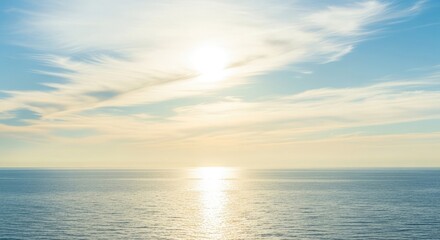 Obraz premium Serene ocean landscape with calm waters and vibrant sky during sunrise viewed from a distant perspective