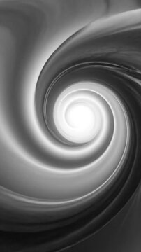 Bright light at the end of a swirling abstract grayscale tunnel