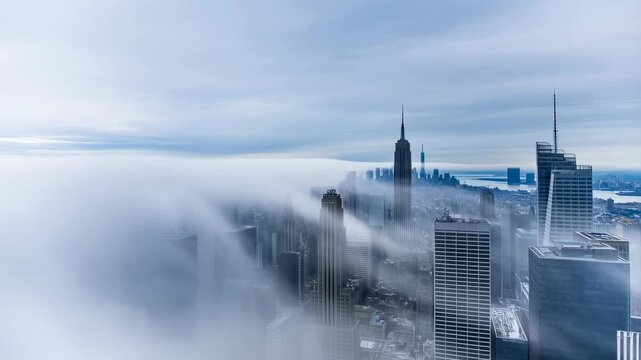 Aerial view of a city skyline shrouded in fog, showcasing iconic skyscrapers emerging from the mist. Represents urban life and the beauty of nature's interplay with architecture