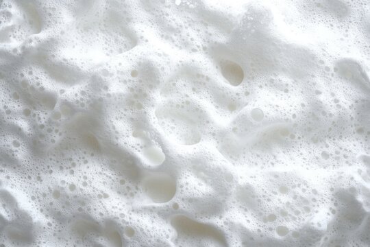 close-up of creamy white foam with varied bubbles and airy texture evoking a soft, soothing mood