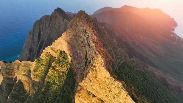 Jagged mountain ridge with ocean view at sunrise/sunset