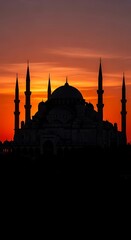 Obraz premium Silhouette of a mosque at sunset.