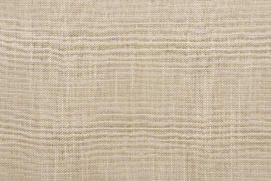 Brown linen fabric cloth texture background, seamless pattern of natural textile.