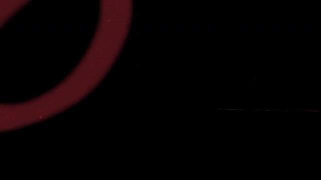 A red circle partially visible on a black background with a subtle gradient effect, creating a sense of depth and mystery.