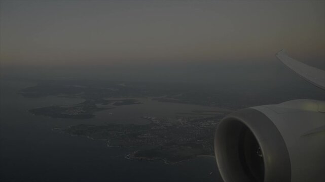 Aerial View of Boeing 787 Wing and Engine During Final Approach to Sydney Kingsford Smith Airport at Sunrise