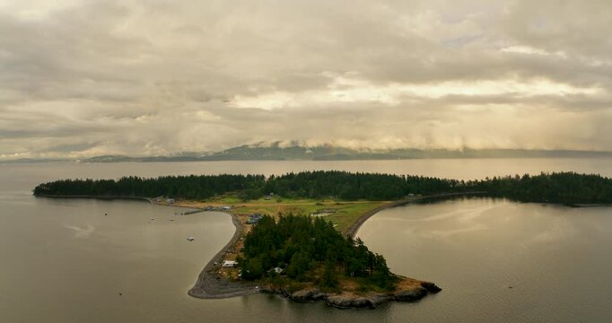 Aerial Flying Toward Bellingham from Eliza Island with Rainbow Under Golden Storm Clouds