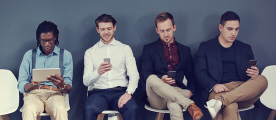 Interview, row and men with tech in waiting room for job opportunity, online resume and...