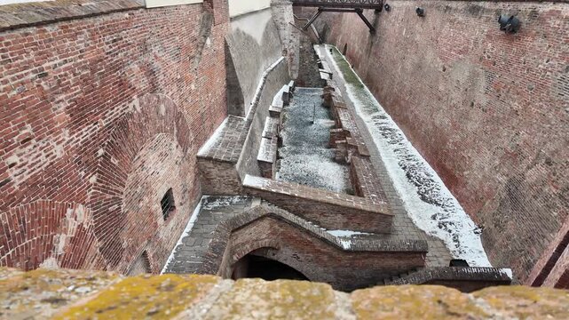 Slow motion macro of &Scaron;pilberk Castle fortifications and brick walls in winter, Brno
