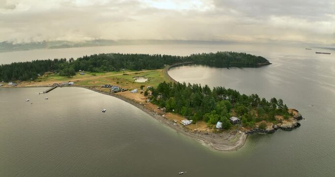 Aerial Pulling Away from Eliza Island at Sunset with Rainbow and Bellingham in Distance