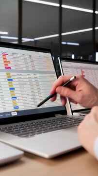 Financial Analyst Man Using Spreadsheet Software On Laptop To Analyze Data