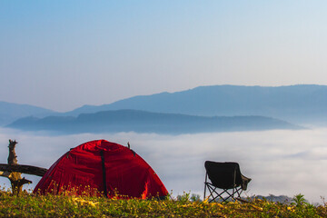 tent in the mountains with view sea of mist