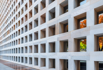 Modern architectural design highlights grid pattern in urban setting during daylight