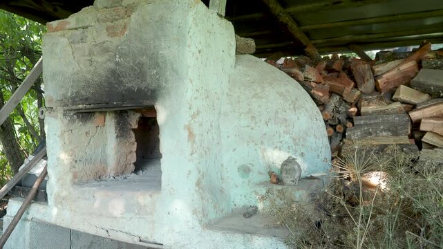Traditional wood fired bread oven with pastries in Romania