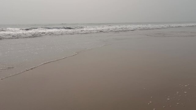 Transparent Sea Waves Revealing Sandy Bottom in Slow Motion
