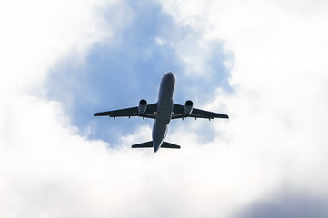 Fototapeta premium Airplane in the sky. Air travel. 