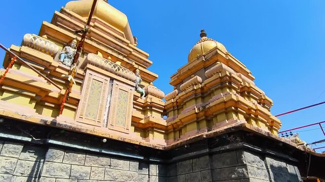 Old architecture of temple shikhara with granite stone wall at balaji temple, kodangal, telangana, india. day time, zib shot, 4k.