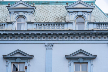 Ornate historic blue building facade with mansard roof © Mirko