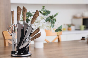 Set of knives on table in kitchen, closeup