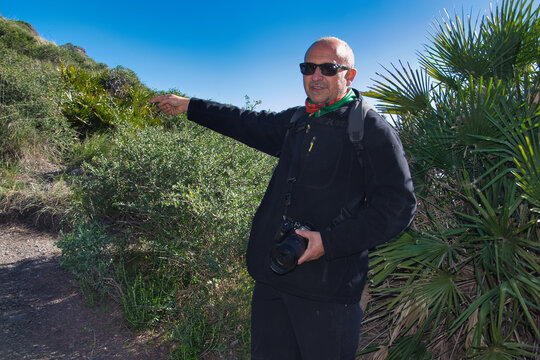 Man points in the direction to follow