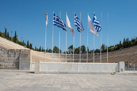Athens, Greece - July 18, 2024: Flags in Front of Panathenaic Stadium in Athens, Greece. Location for the First Modern Olympic Games in 1896