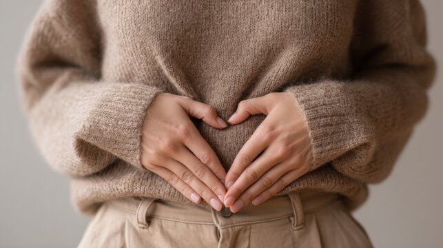 Pregnant woman in peaceful reflection. Tranquil prenatal scene featuring caring pregnant woman. Serene and peaceful pregnant woman cradles her belly with tender hands while embracing selfcare