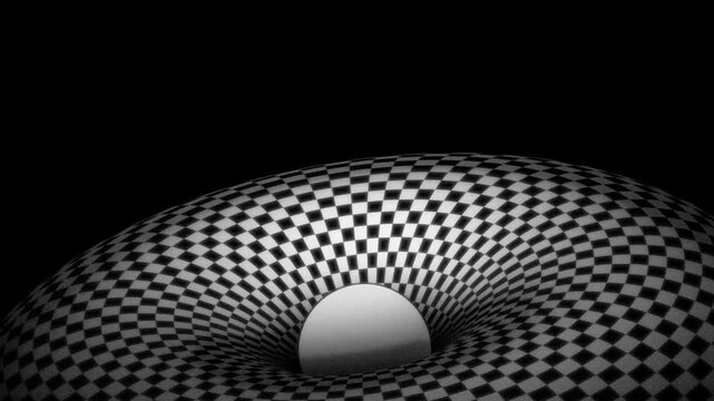 A geometric torus with a symmetrical checkered pattern surrounds a central void containing a sphere, shown in monochrome lighting with high contrast