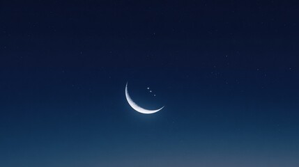 Crescent moon and stars in the dark night sky