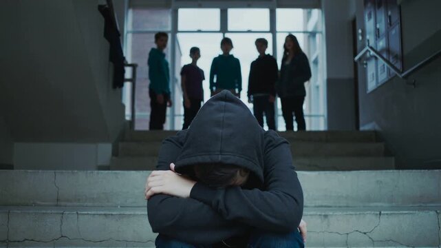 Teenager feeling isolated and excluded by peers in school