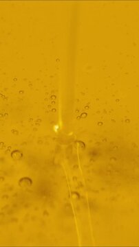  motion of pouring oil, texture background in vertical video