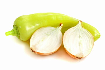 Green pepper with halved onion on a white background.