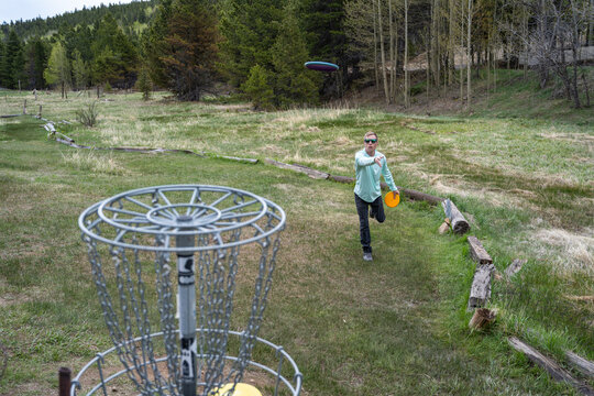 Disc Golf Approaching Basket in Mountain Meadow