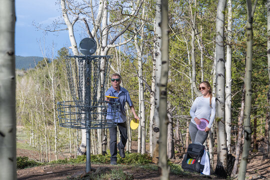 Active Outdoors: Friends Enjoying a Round of Disc Golf