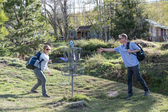 Adult Friends Enjoying a Round of Mountain Disc Golf