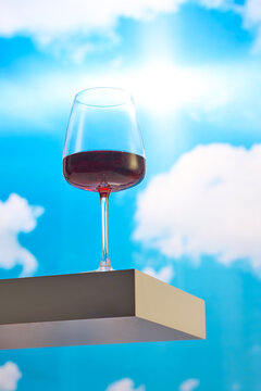 Glass of Red Wine Against the Sky