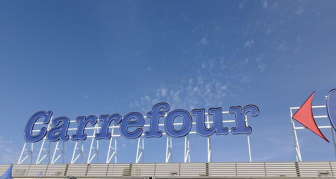 Carrefour store sign against blue sky