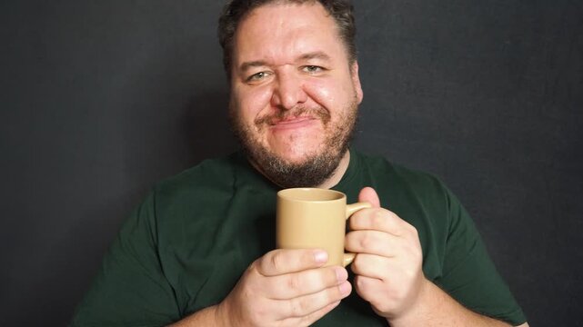 Funny fat man drinking hot coffee