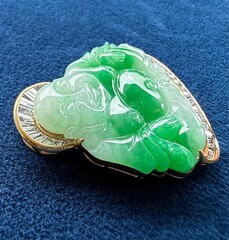 A HandCarved Jade Pendant in the Shape of a Crane Set with Micro