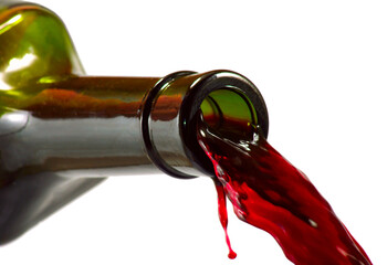 Wine flowing from a bottle showing rich red color isolated on transparent background, PNG file
