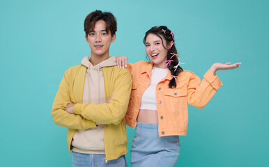 Young couple portrait standing together smiling confidently expressing love partnership and joyful lifestyle connection in modern casual fashion.