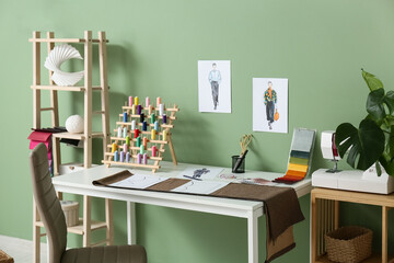 Interior of atelier with tailor's workplace and shelf units