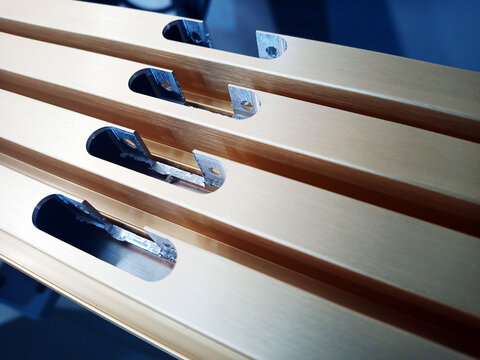 aluminum facade profile with inset hinge holes. furniture parts in production.