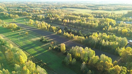 Aerial view of autumn farmland and green fields © AlexGo